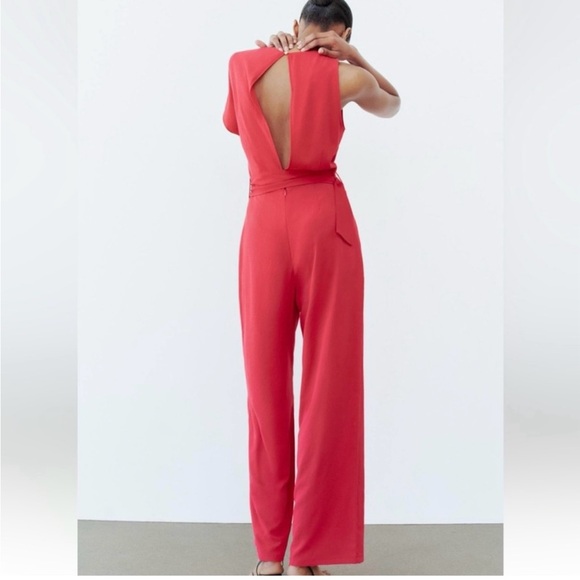 ASYMMETRIC CREPE BUCKLE JUMPSUIT
RED / CORAL . SIZE M, L - Picture 10 of 16